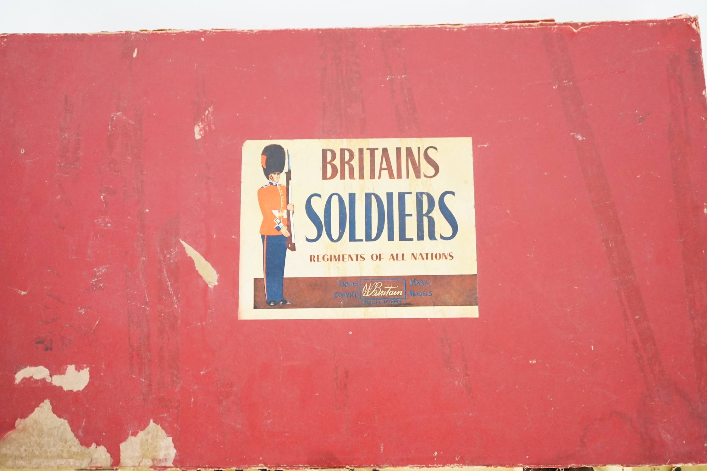 A Britains ‘Regiments Of All Nations’ series box of lead soldiers, including twelve Scottish Highlander infantrymen, eleven marching bandsmen